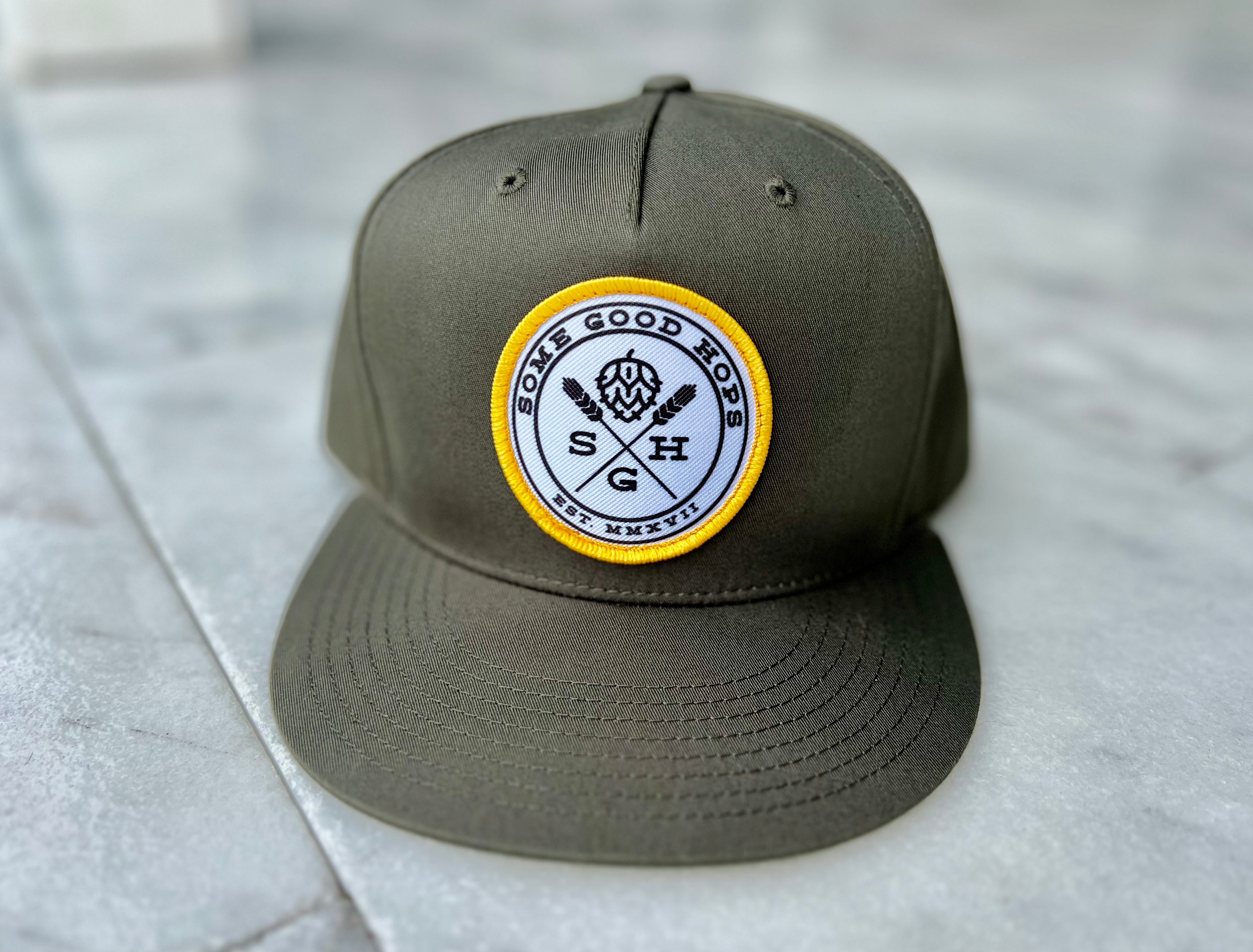 Some Good Hops Olive Green SnapBack Hat with Yellow Stitching and Black Logo (Front View)